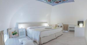 Uma cama ou camas num quarto em Dimora Dell'Osanna