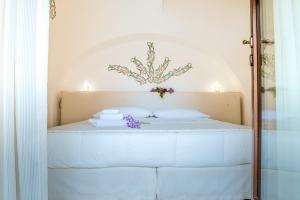 Uma cama ou camas num quarto em Dimora Dell'Osanna
