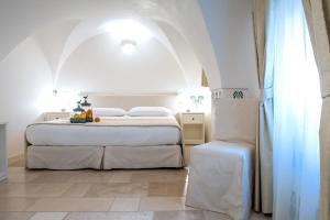 Uma cama ou camas num quarto em Dimora Dell'Osanna