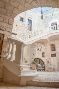 a building with a staircase in front of a building at Dimora Dell'Osanna in Carovigno