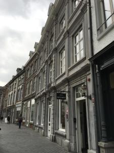 a large building with a large window on the side of it at Boutique Hotel Grote Gracht in Maastricht