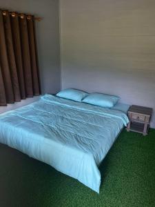 Katil atau katil-katil dalam bilik di BOONDEE Homestay