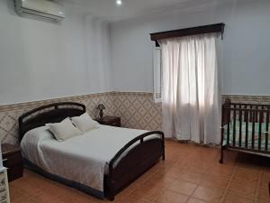 Ένα ή περισσότερα κρεβάτια σε δωμάτιο στο Fontinhas House