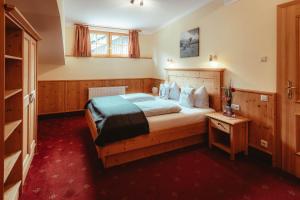 Posteľ alebo postele v izbe v ubytovaní Hotel Gasthof Walcher