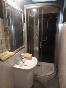 a bathroom with a sink and a shower at Sarok Villa in Siófok +42 photos