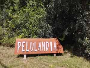 a sign that says pelilliamnka in front of a bush at Fusión Natural in Playa Verde