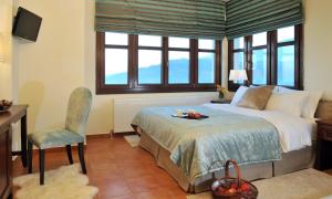 Postel nebo postele na pokoji v ubytování Guesthouse Kapaniaris