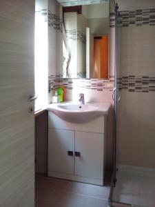 a bathroom with a sink and a shower at B&B Anna Fiera in Verona