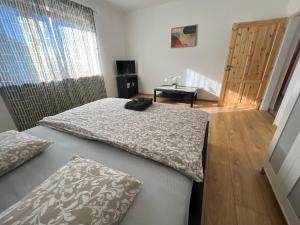 Postel nebo postele na pokoji v ubytování BALU CITY APARTMeNT