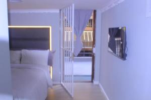 Ένα ή περισσότερα κρεβάτια σε δωμάτιο στο Good Night Guest Lodge