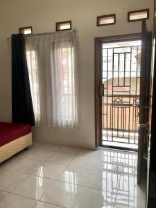 Ένα ή περισσότερα κρεβάτια σε δωμάτιο στο Grania Homestay