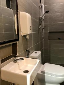 a bathroom with a sink and a toilet at Kavy Boutique Hotel @ KBH in Brinchang +20 photos