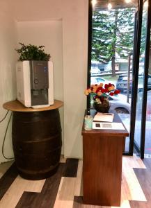 a microwave sitting on top of a barrel with a table at Kavy Boutique Hotel @ KBH in Brinchang