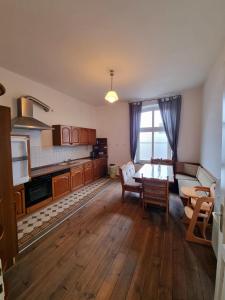 a kitchen with a table and a dining room at Ferienwohnung Maria im alten Pastorat in Kevelaer
