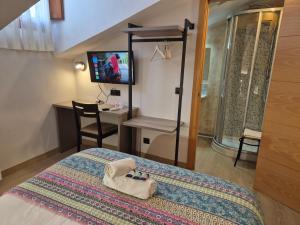 Postel nebo postele na pokoji v ubytování Hostal Bavieca