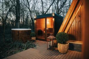 a small cabin on a deck in the woods at Paplanka Boutique Cabin in Nyírbátor