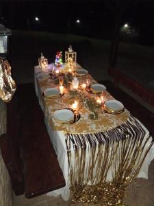 a table with christmas lights and candles on it at La casa Chiappelle in Cortemilia