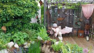 a garden with a bench and some plants at Thalerhof in Roppen