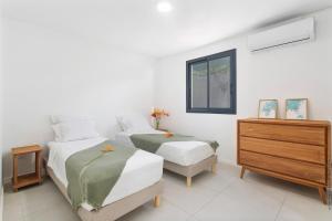Postel nebo postele na pokoji v ubytování Villa Casalta - Vue Mer Caraïbes