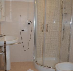 a bathroom with a shower and a sink at Da zia Rosina in Lamezia Terme