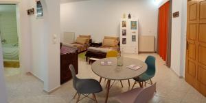 a living room with a table and chairs at Irini in Thérissos