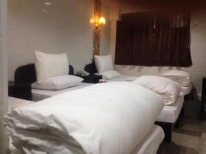 Voodi või voodid majutusasutuse ILoilo Guest House toas