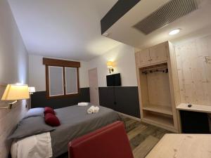 Postel nebo postele na pokoji v ubytování Damodoro Hotel