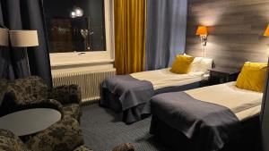 Posteľ alebo postele v izbe v ubytovaní Hotel Jämteborg
