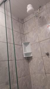 a shower stall with a toilet in a bathroom at Casa simples Natal Luz e FIG in Garanhuns +23 photos