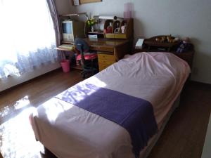 Postel nebo postele na pokoji v ubytování OSO Homestay
