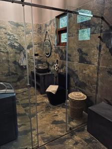 a bathroom with a shower and a sink at Villa Sukka in Tangalle +40 photos