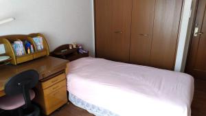 Postel nebo postele na pokoji v ubytování OSO Homestay