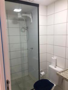 a bathroom with a glass shower with a toilet at Cantinho Praia do Futuro in Fortaleza