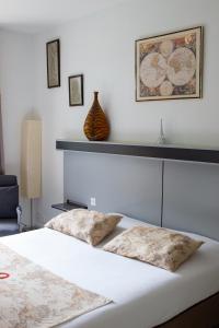 Postel nebo postele na pokoji v ubytování Hôtel Restaurant Le chanel