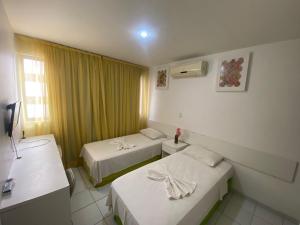 Postel nebo postele na pokoji v ubytování Pousada Mar de Maceió