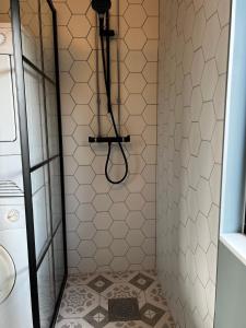 a bathroom with a shower with a tiled floor at Great cottage with unique views and high standard in Tørhogg +30 photos