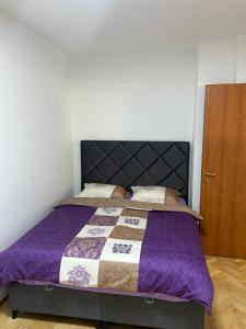 Ένα ή περισσότερα κρεβάτια σε δωμάτιο στο Apartman Sena