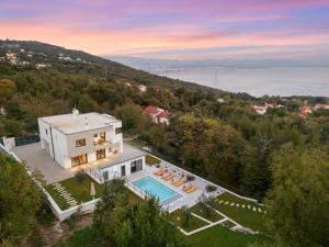 an aerial view of a house with a swimming pool at Casa Calme luxury villa surounded with nature Opatija including EVcharging station in Opatija