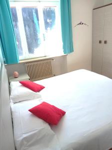 Rúm í herbergi á Hotel B&B Lorenzini Ski