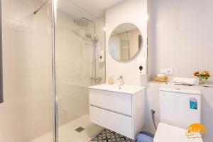 a bathroom with a shower and a toilet and a sink at Retama Golf by Cadiz Time in Novo Sancti Petri +17 photos