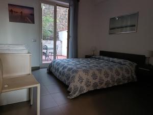 Ένα ή περισσότερα κρεβάτια σε δωμάτιο στο Appartamento fronte mare Taormina - relax e posizione top