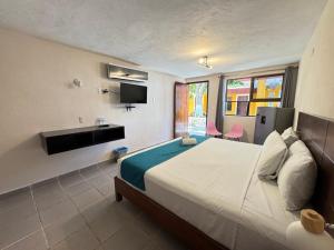 Postel nebo postele na pokoji v ubytování Hotel Caribe + 37 fotografií