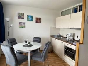 Η κουζίνα ή μικρή κουζίνα στο Panoramic - Wanderlust #329 mit Schwimmbad