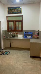 a kitchen counter with a sink and a window at Dream Nest Ahangama in Ahangama