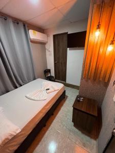 Voodi või voodid majutusasutuse Hotel Almalu toas