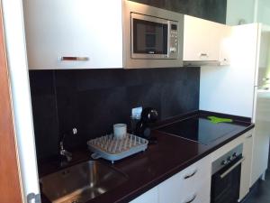 Kuchyň nebo kuchyňský kout v ubytování Attico El Dorado apt 931