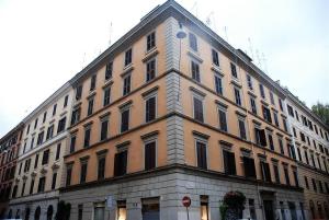 a large building on the corner of a street at Testaccio Stay - your home in the heart of Rome in Rome +4 photos