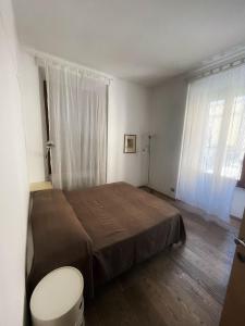 a bedroom with a bed and a toilet in it at Testaccio Stay - your home in the heart of Rome in Rome