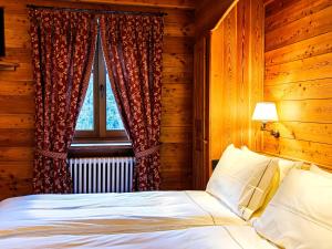 Ένα ή περισσότερα κρεβάτια σε δωμάτιο στο Hotel Breithorn