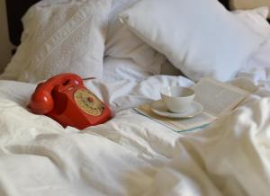A bed or beds in a room at queen 24
